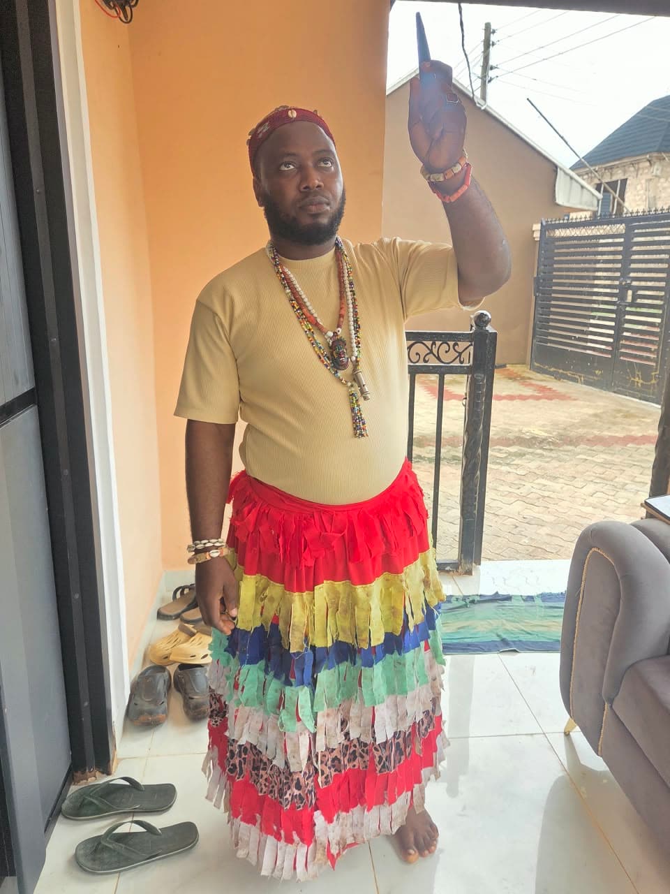 Dr. Iteh in layered ceremonial attire